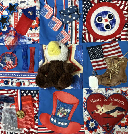 The 500th fidgit quilt created by a group of chapter members as gifts to memory impaired persons.