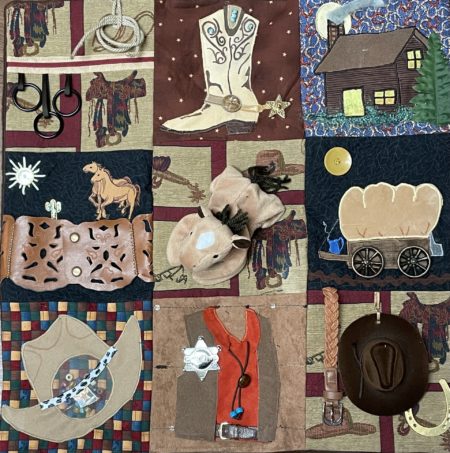 This photo is a close up of a fidget quilt showing nine squares of the quilt, each with a western theme.
